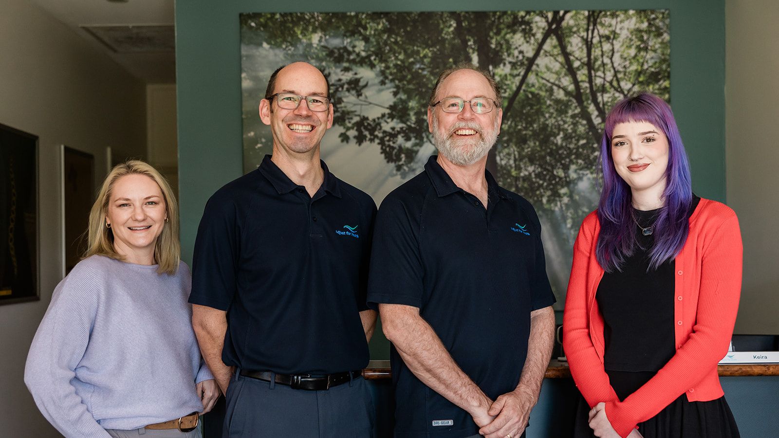 Chiropractors Travis Webb and Michael Shobbrook with front desk staff